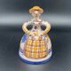 Trio of ceramic bell figurines