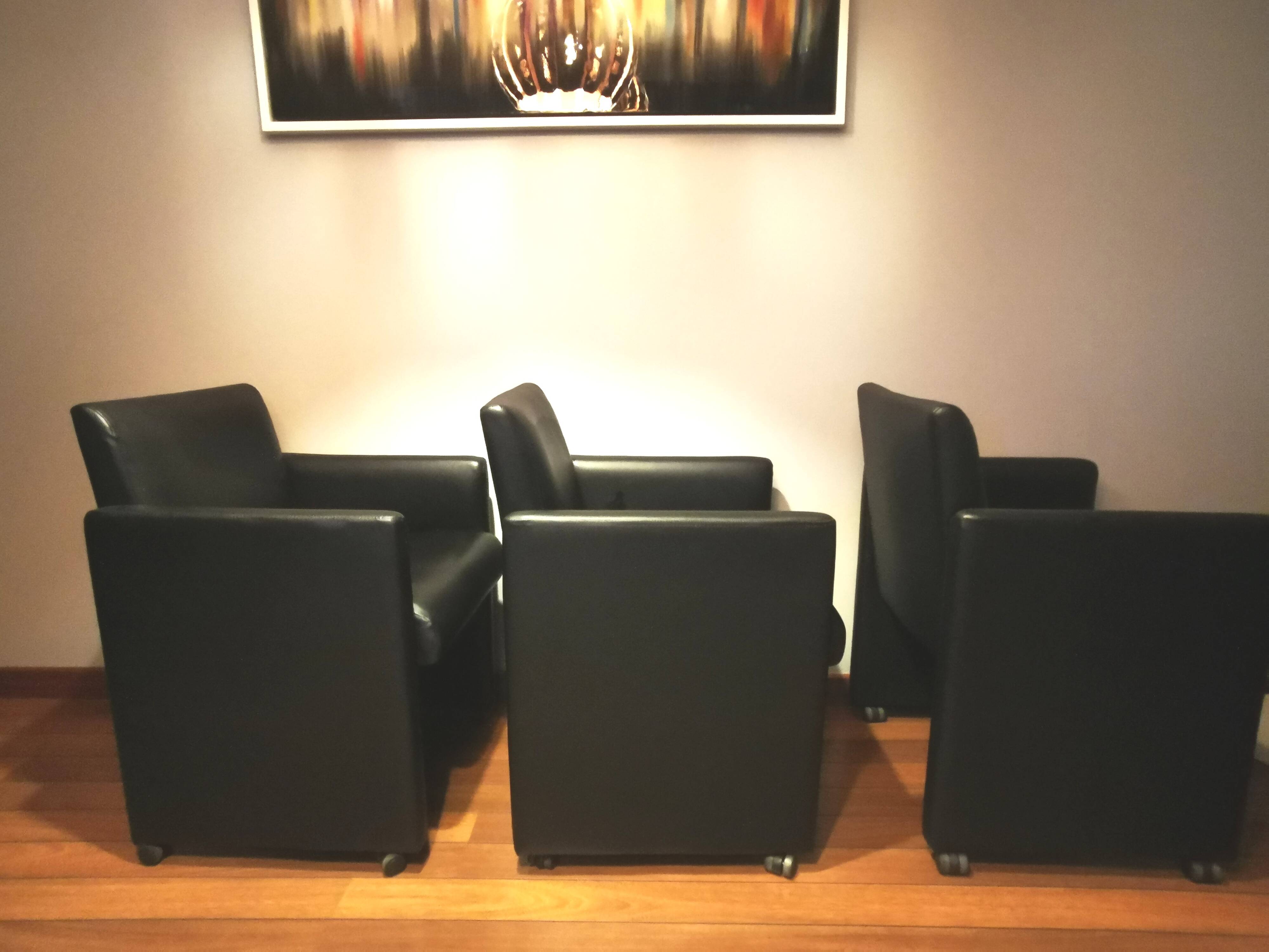 6 faux leather chairs on wheels