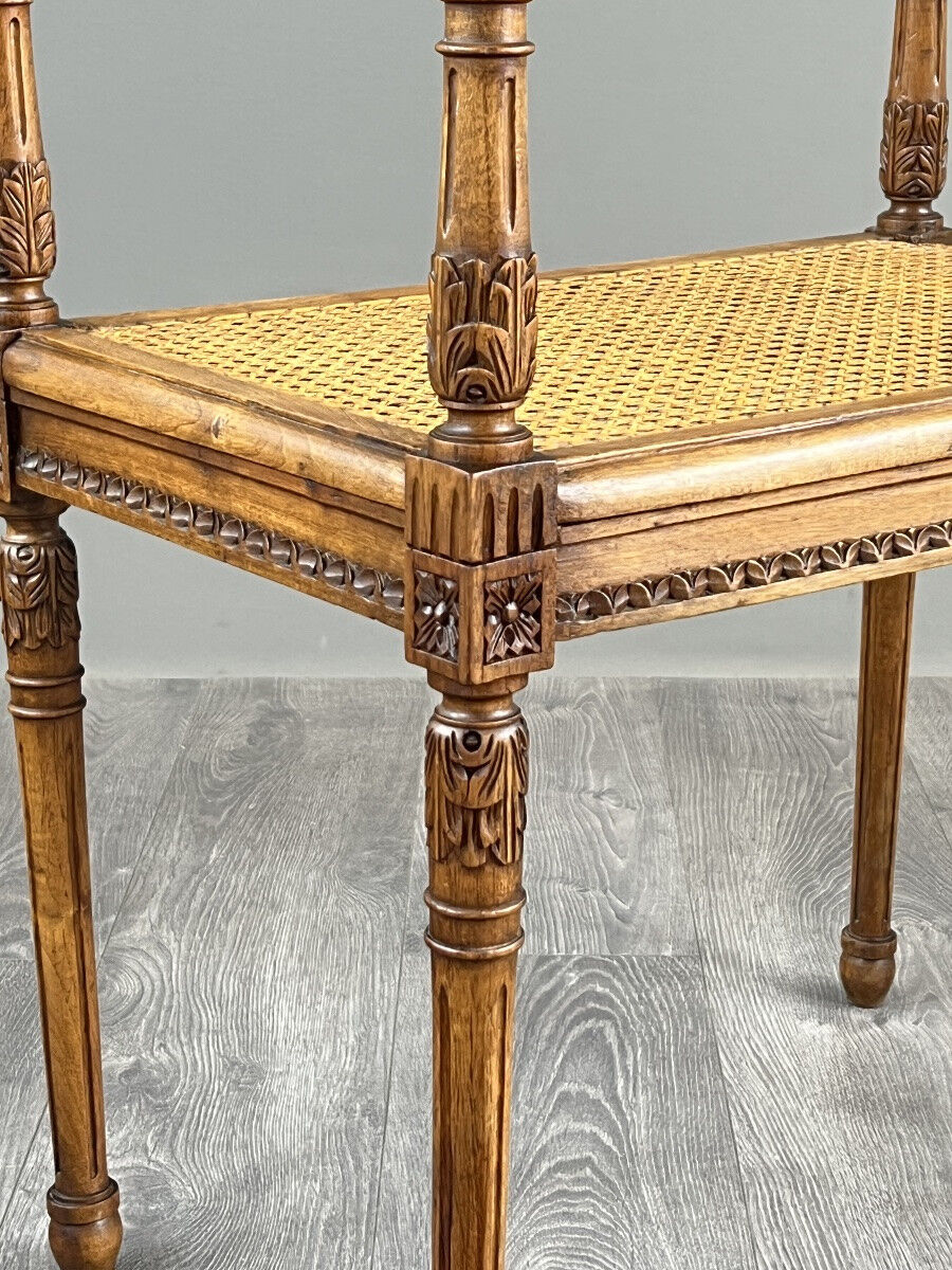 Banquette / tabouret en bois sculpté et cannage, XXe siècle