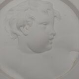 Portrait cast in low relief on plaster. SEDAP workshop.
