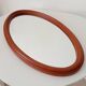 Vintage oval wooden mirror "caramel" from the 1960s.