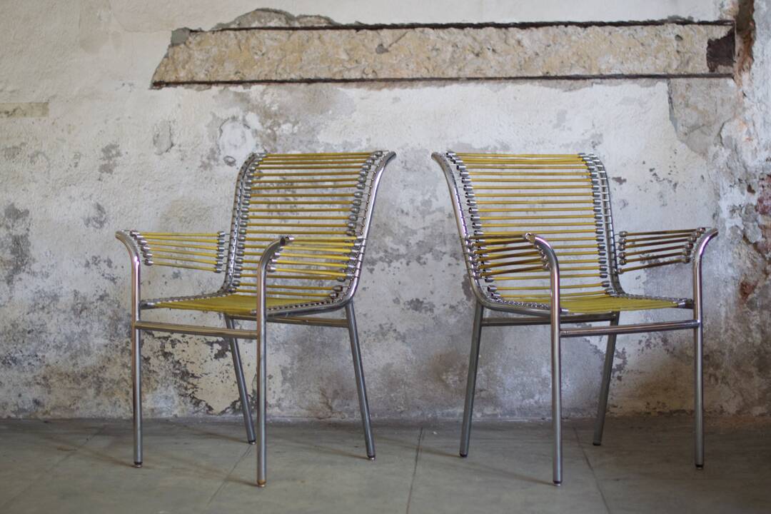 Two Rene Herbst Infabrica style Bungee armchairs