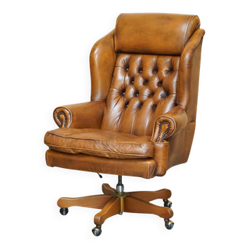 Fauteuil capitaine Chesterfield cuir vintage dossier oreilles capitonné