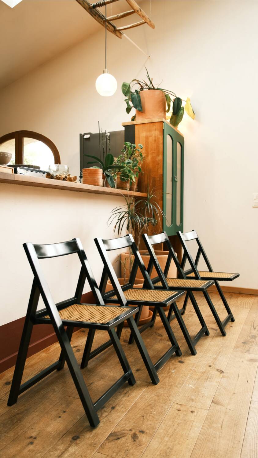 4 black cane folding chairs