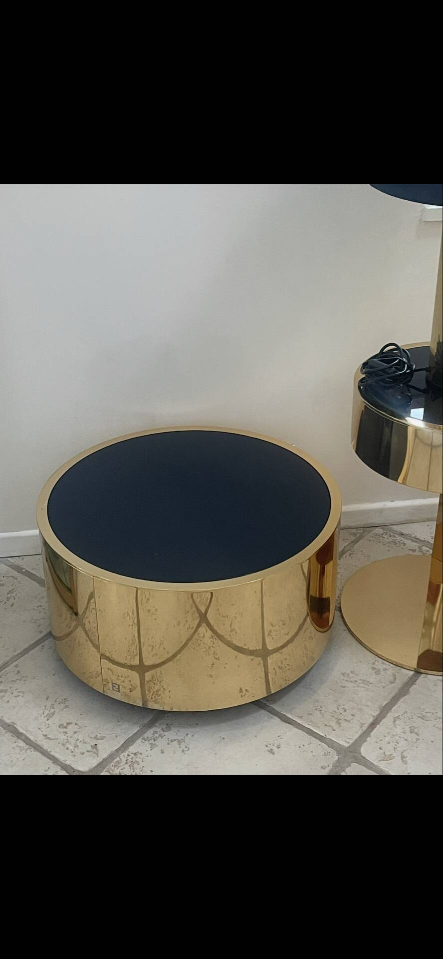 2 bedside tables and a brass Fendi table.