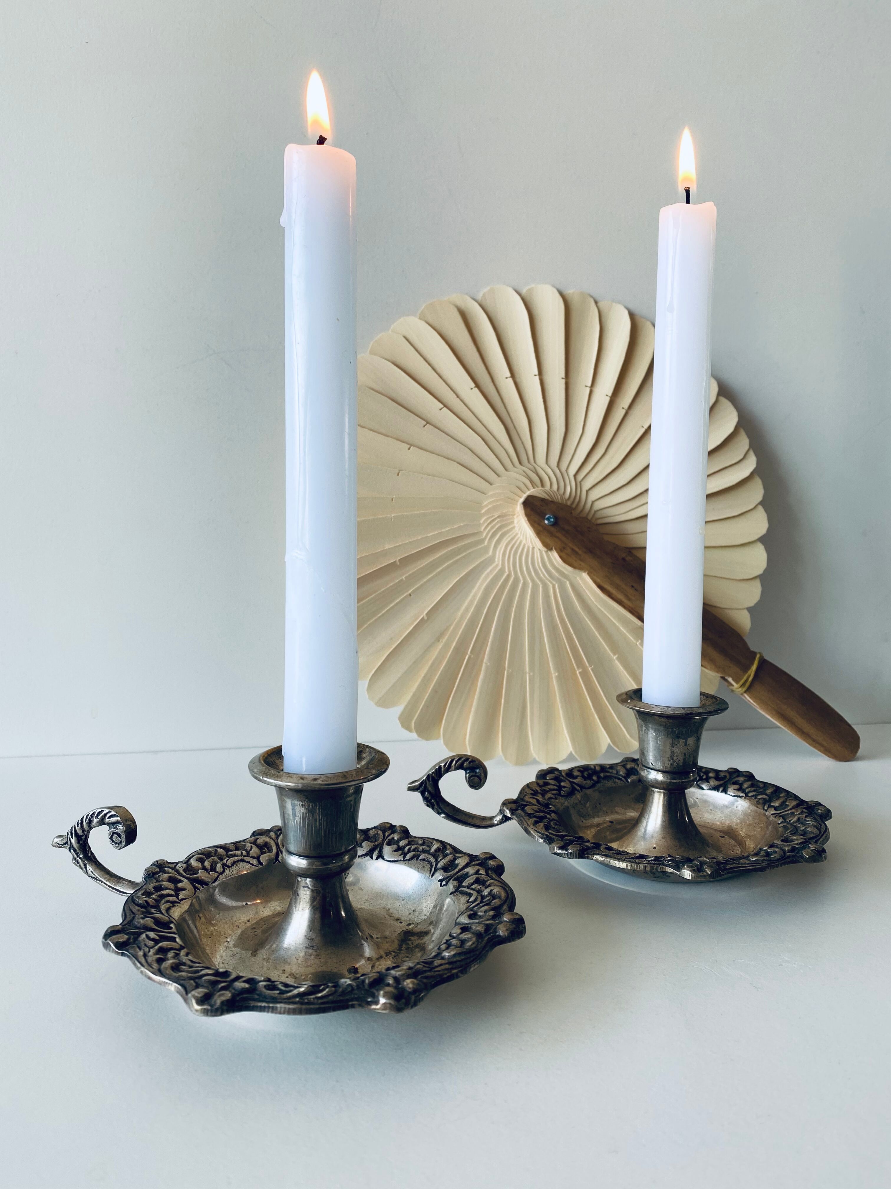 Pair of silver metal candlesticks