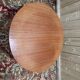 Round dining table with tulip base, 1960s design.