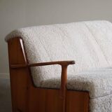 Modern Swedish two-seater independent sofa bed in pine and lambswool, 1950s.