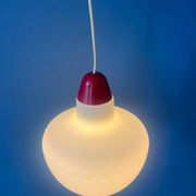 Mid-Century opaline glass suspension with a red upper part and ceiling cover.