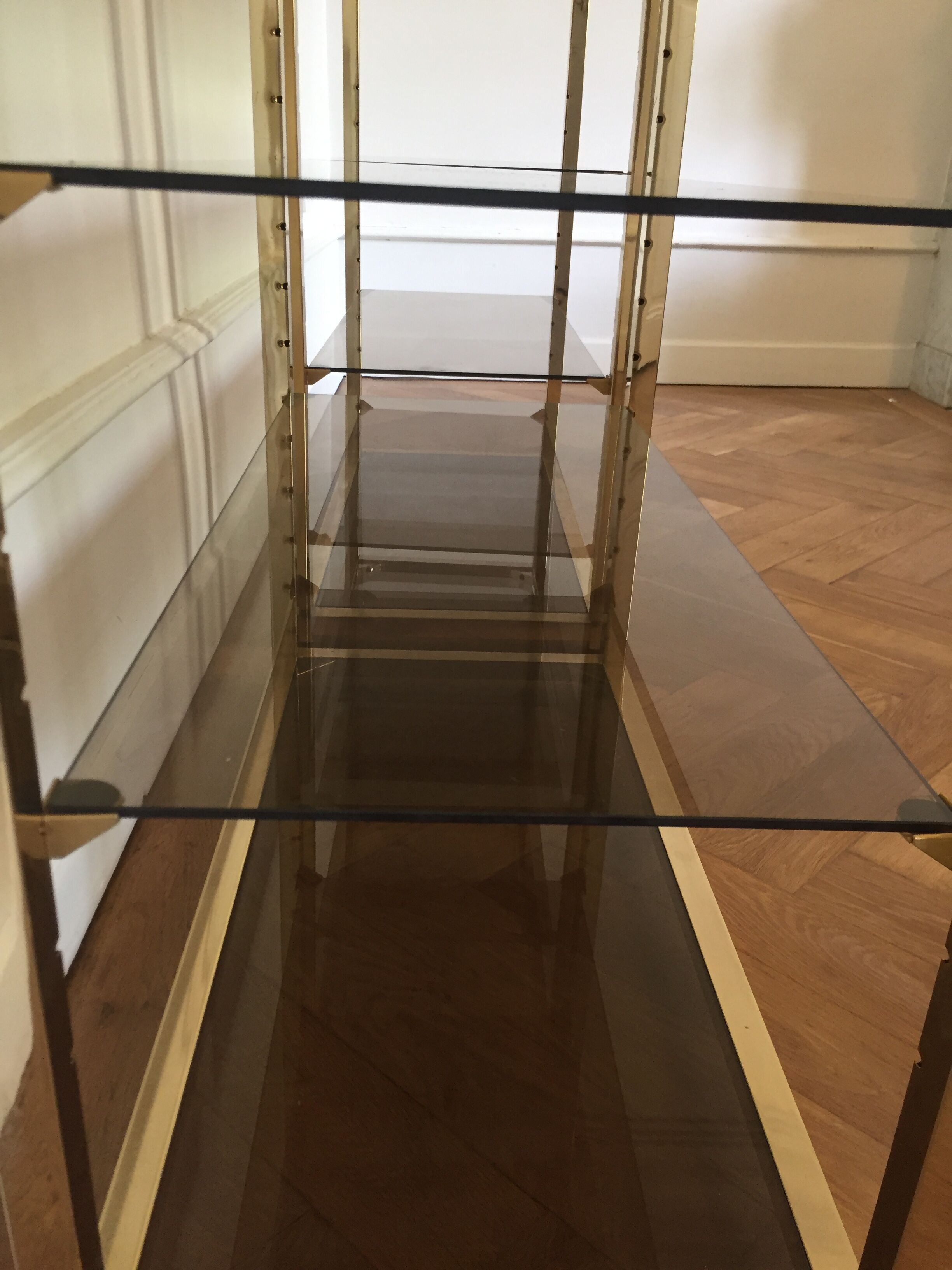 Pair of consoles brass shelves and smoked glass design Roche Bobois