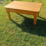 Solid oak coffee table with turned legs.
