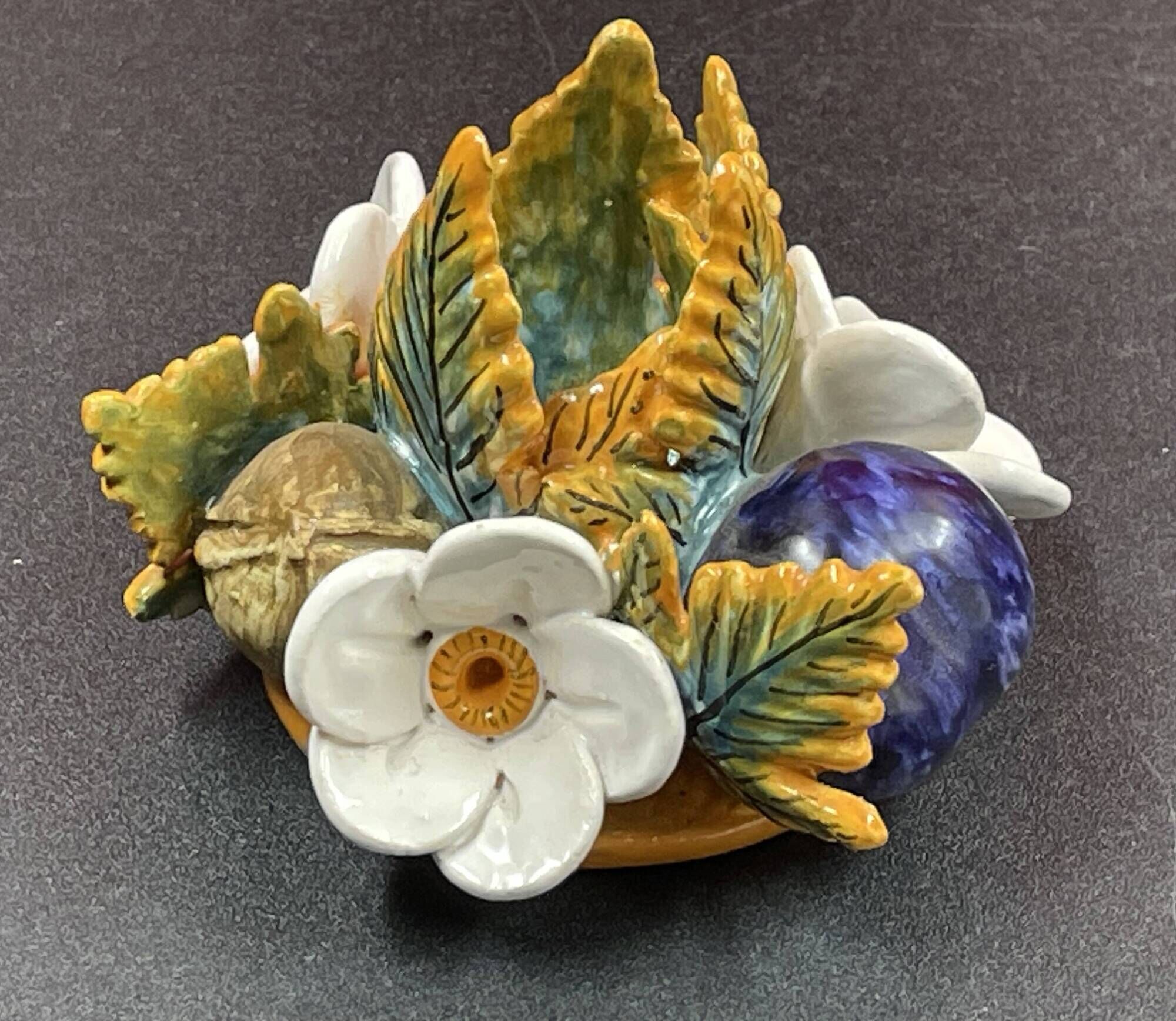 Candlestick with flowers and fruits in slip, Malicorne ceramic