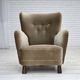 Fauteuil danois des années 1960, velours vert, pieds en bois de chêne.