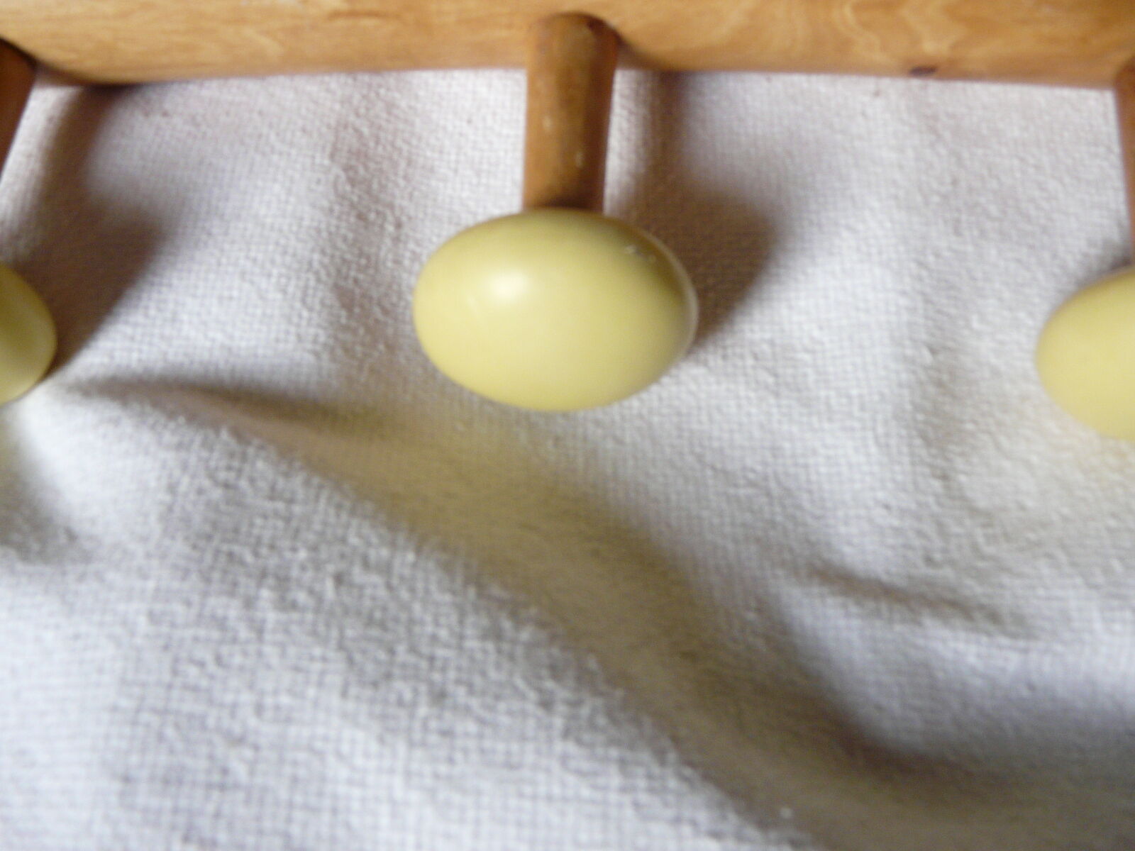 Wearing coat wooden with colored balls