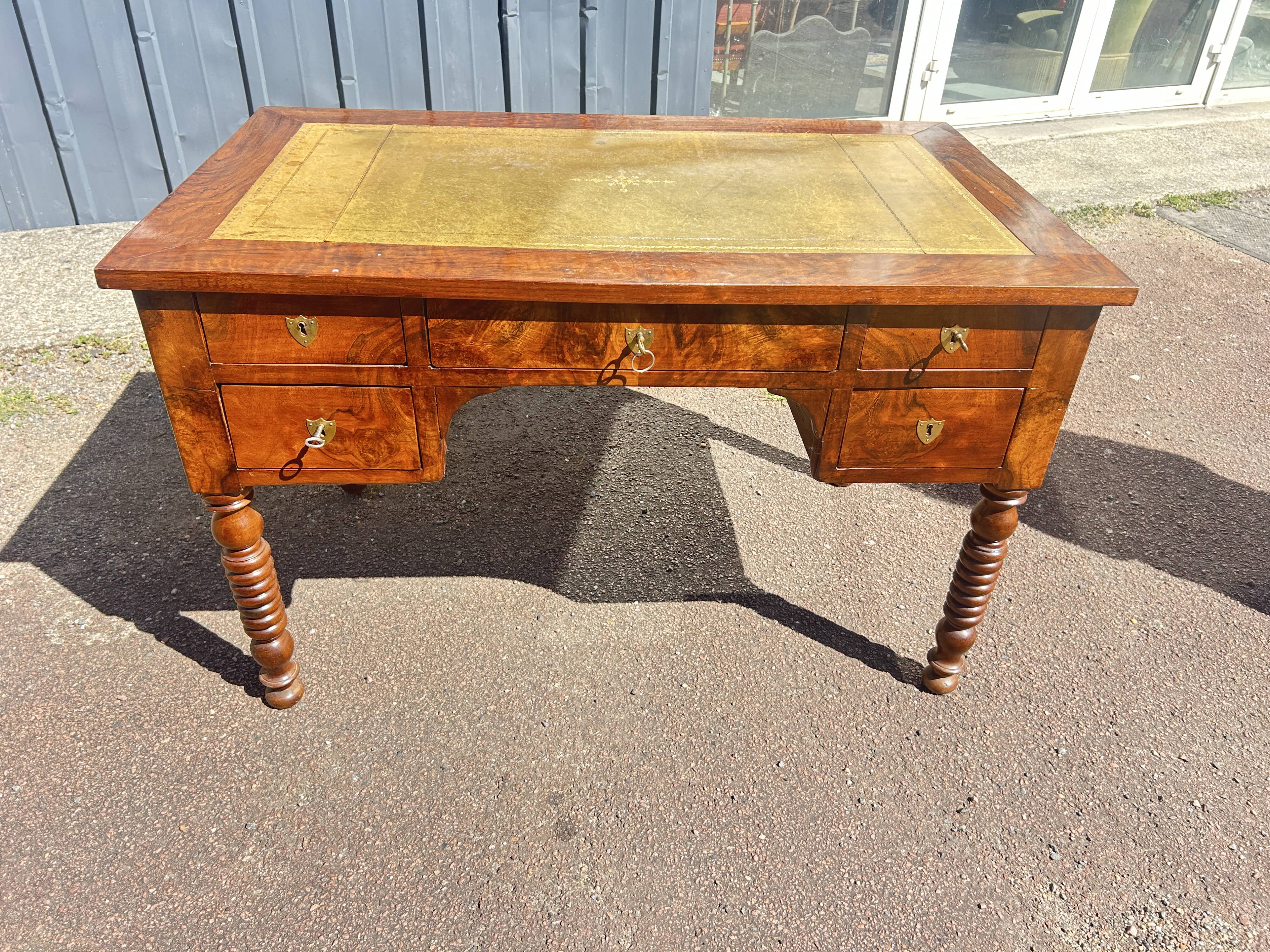 Louis Philippe desk in walnut, with a leather top.