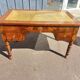 Louis Philippe desk in walnut, with a leather top.