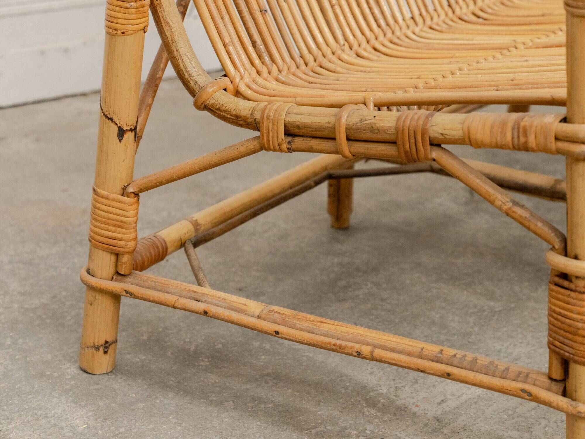 Vintage bamboo and rattan bench from the 1970s.