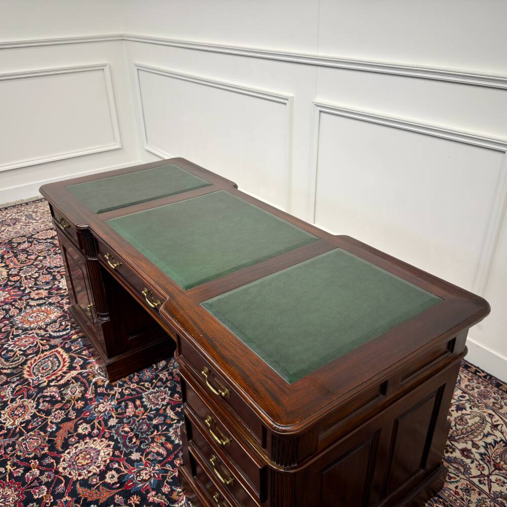 Classic English desk with green leather inlay.