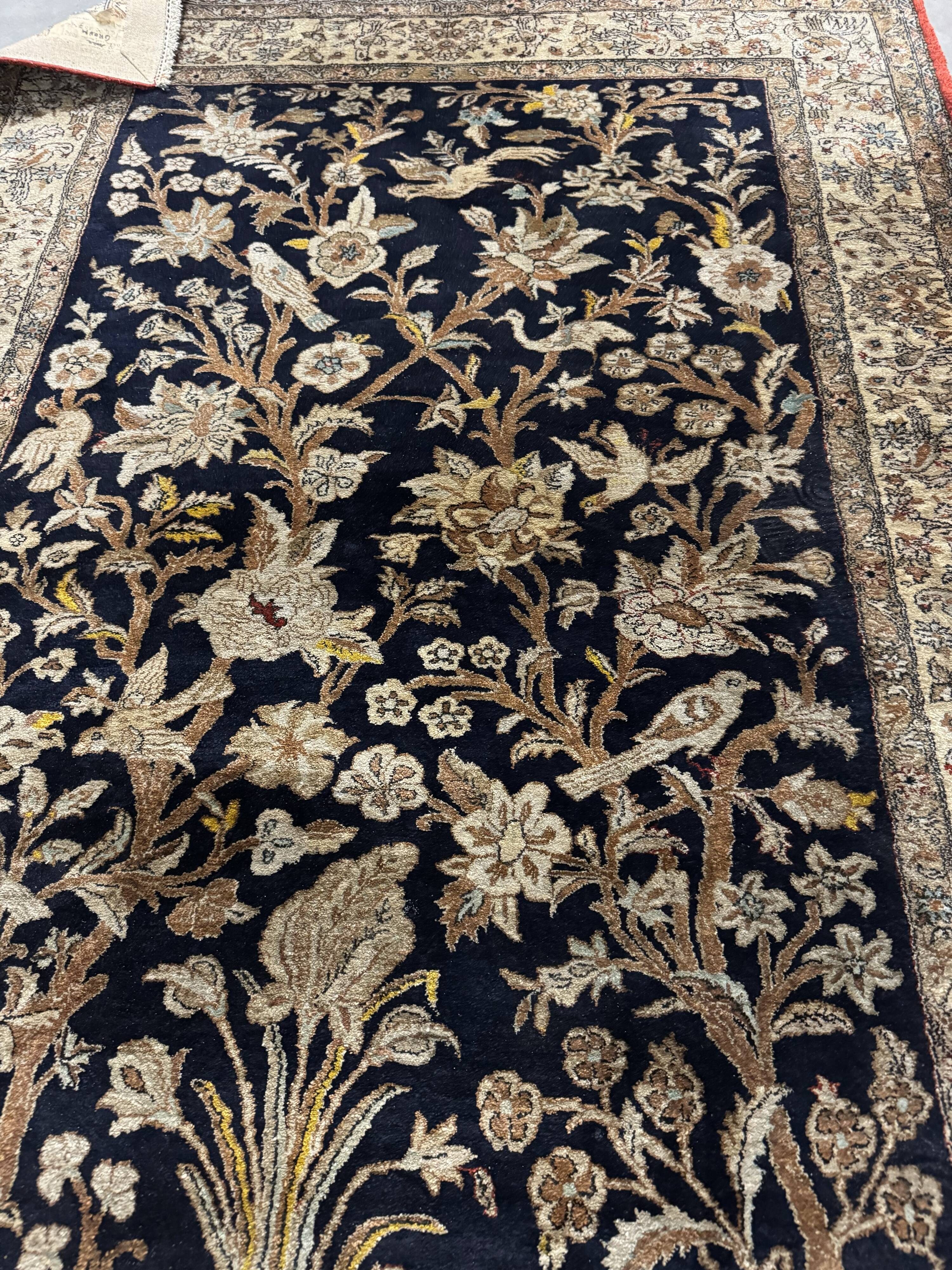 Handmade silk Persian carpet