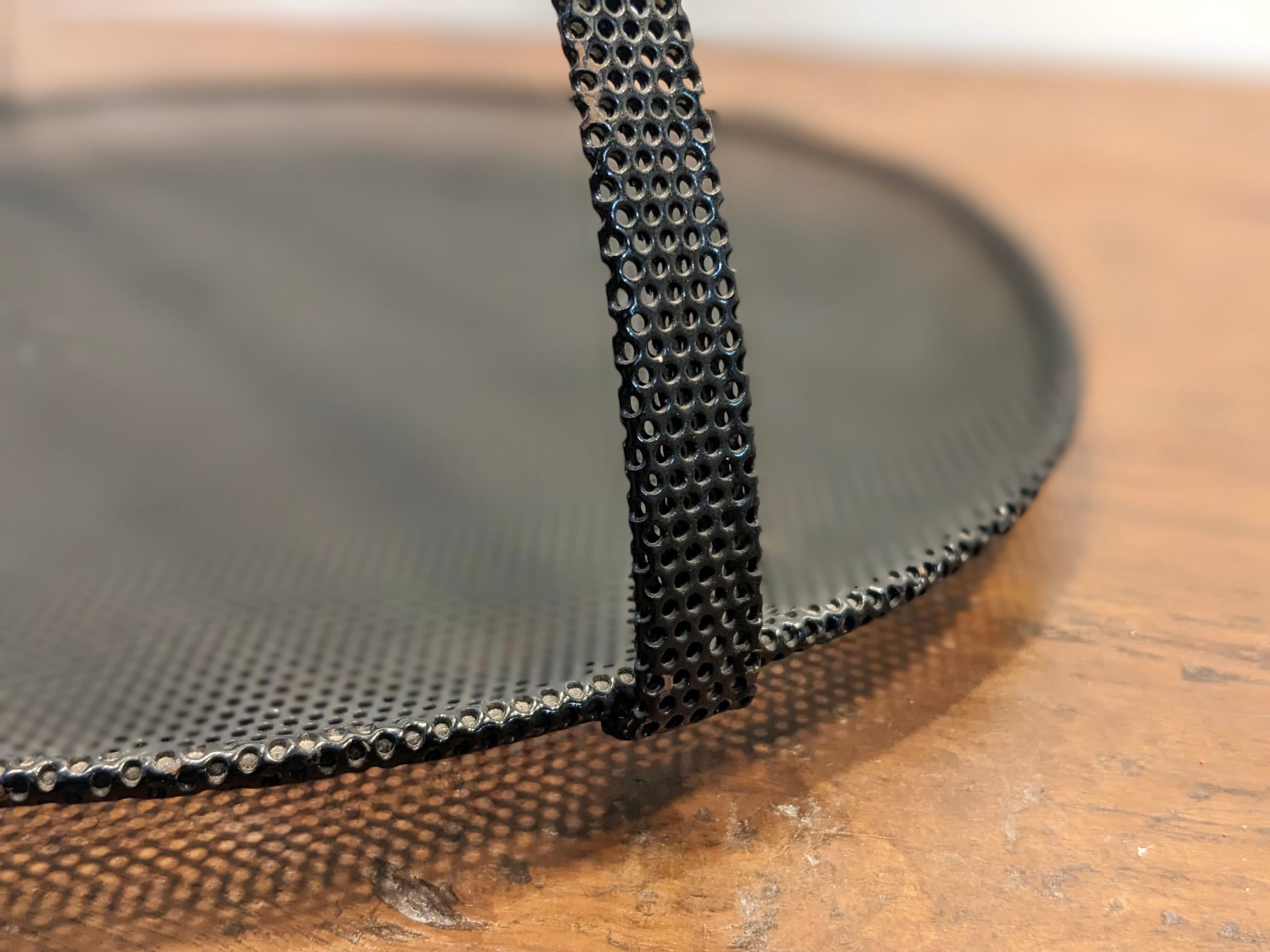 Black metal basket by Mathieu Mategot