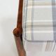 Vintage armchair and beige blue tartan footrest modern design