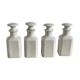 4 old white pharmacy style bottles