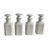 4 old white pharmacy style bottles