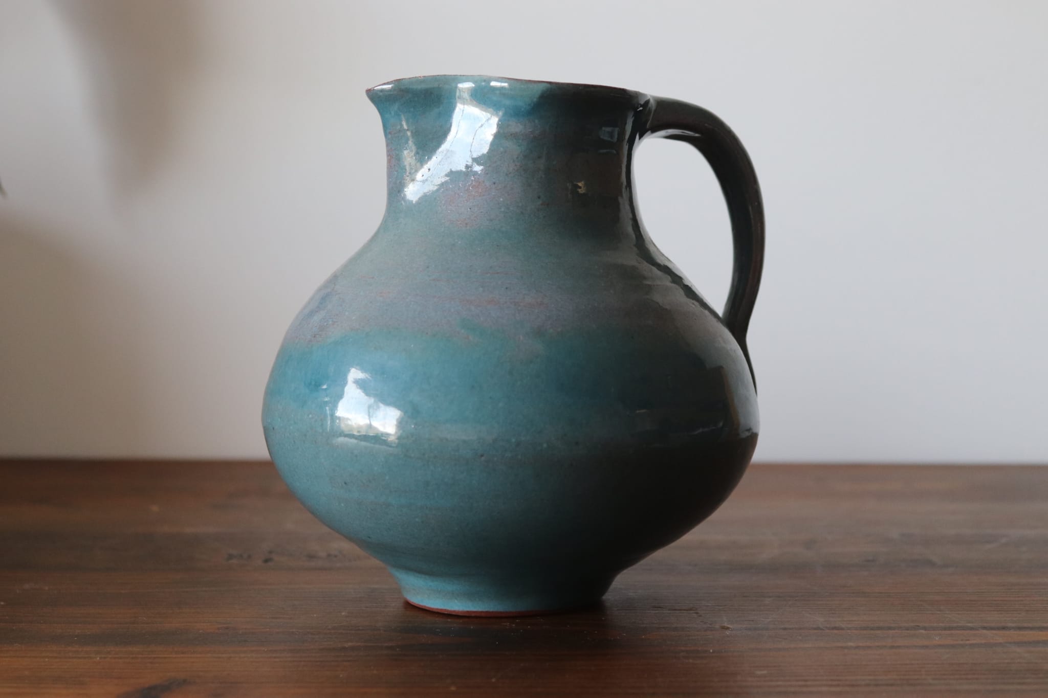 Varnished blue terracotta pitcher