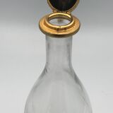 Glass bottle type carafe with gold metal bird head stopper