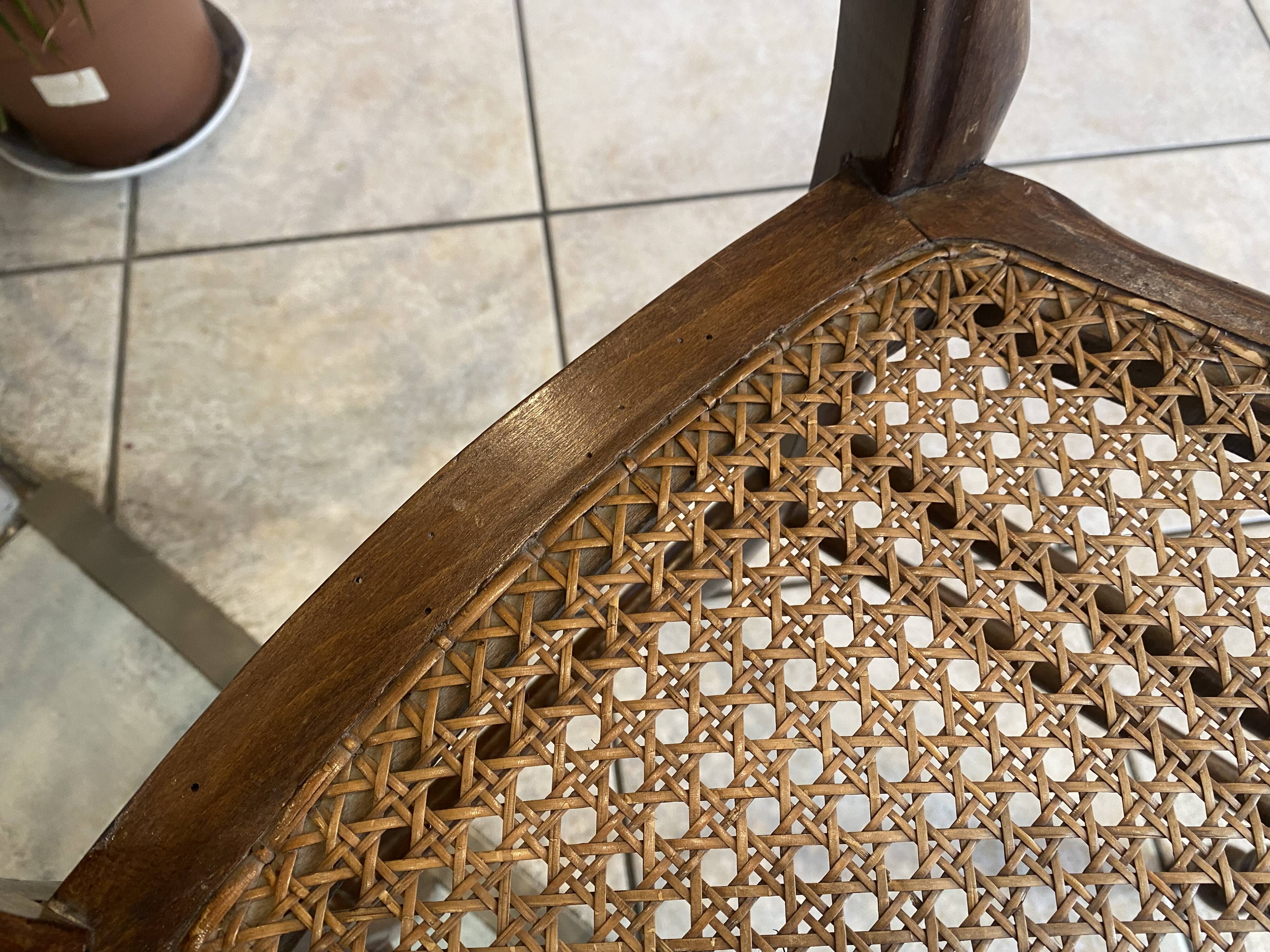 Pair of N2 antique caned and wooden chairs from the 1900s.