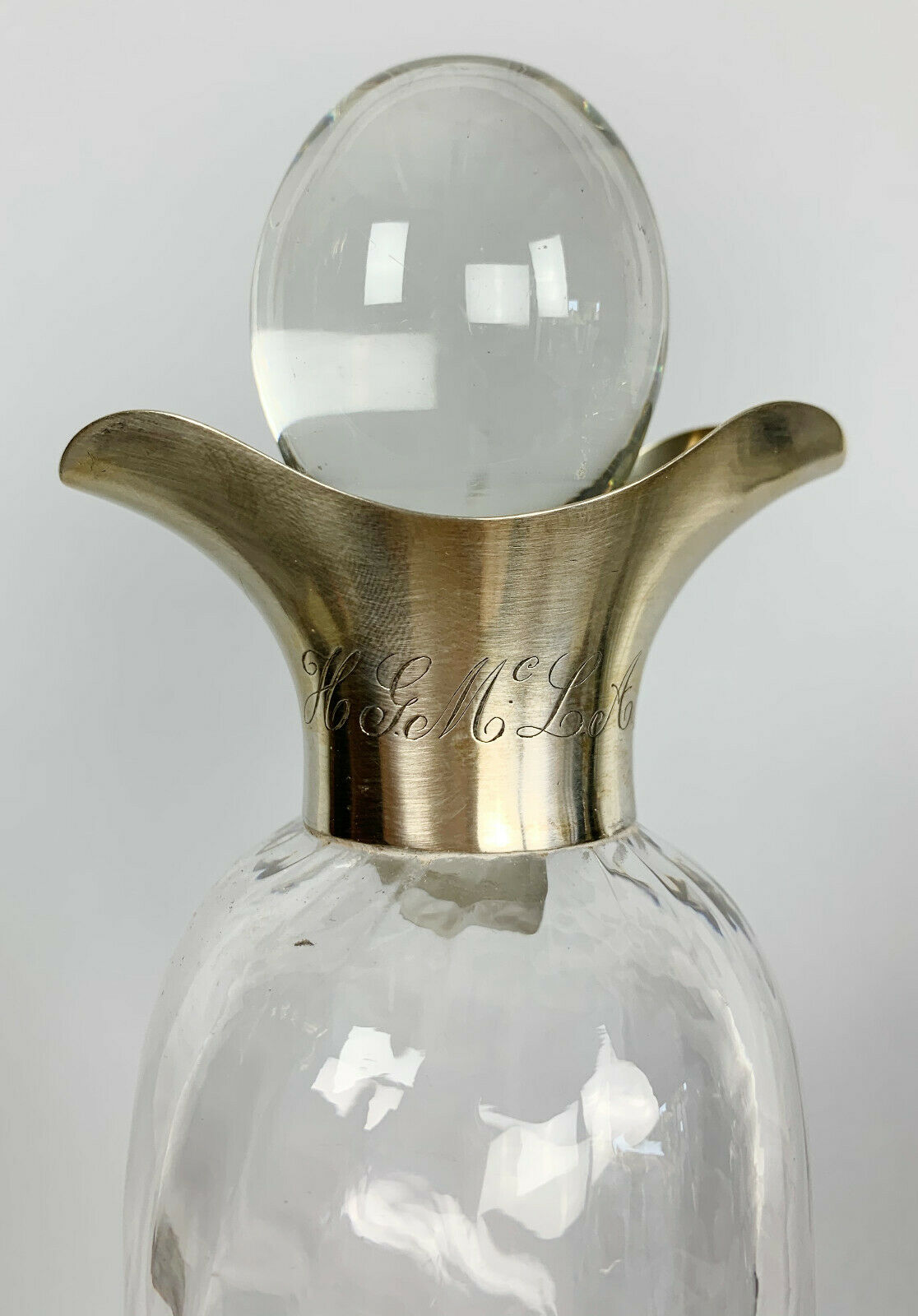 Blown glass carafe with silver frame