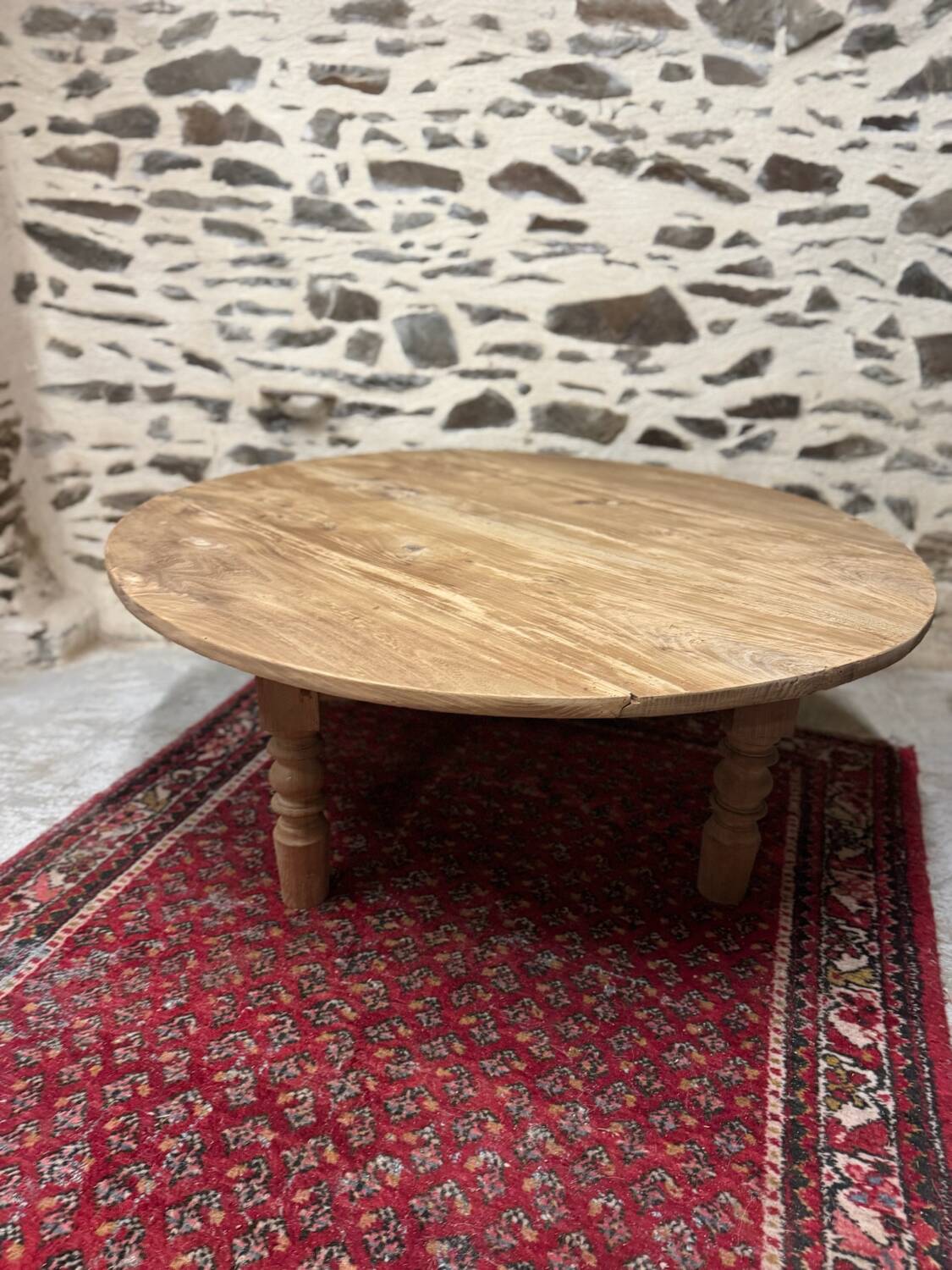 Oval coffee table in raw wood