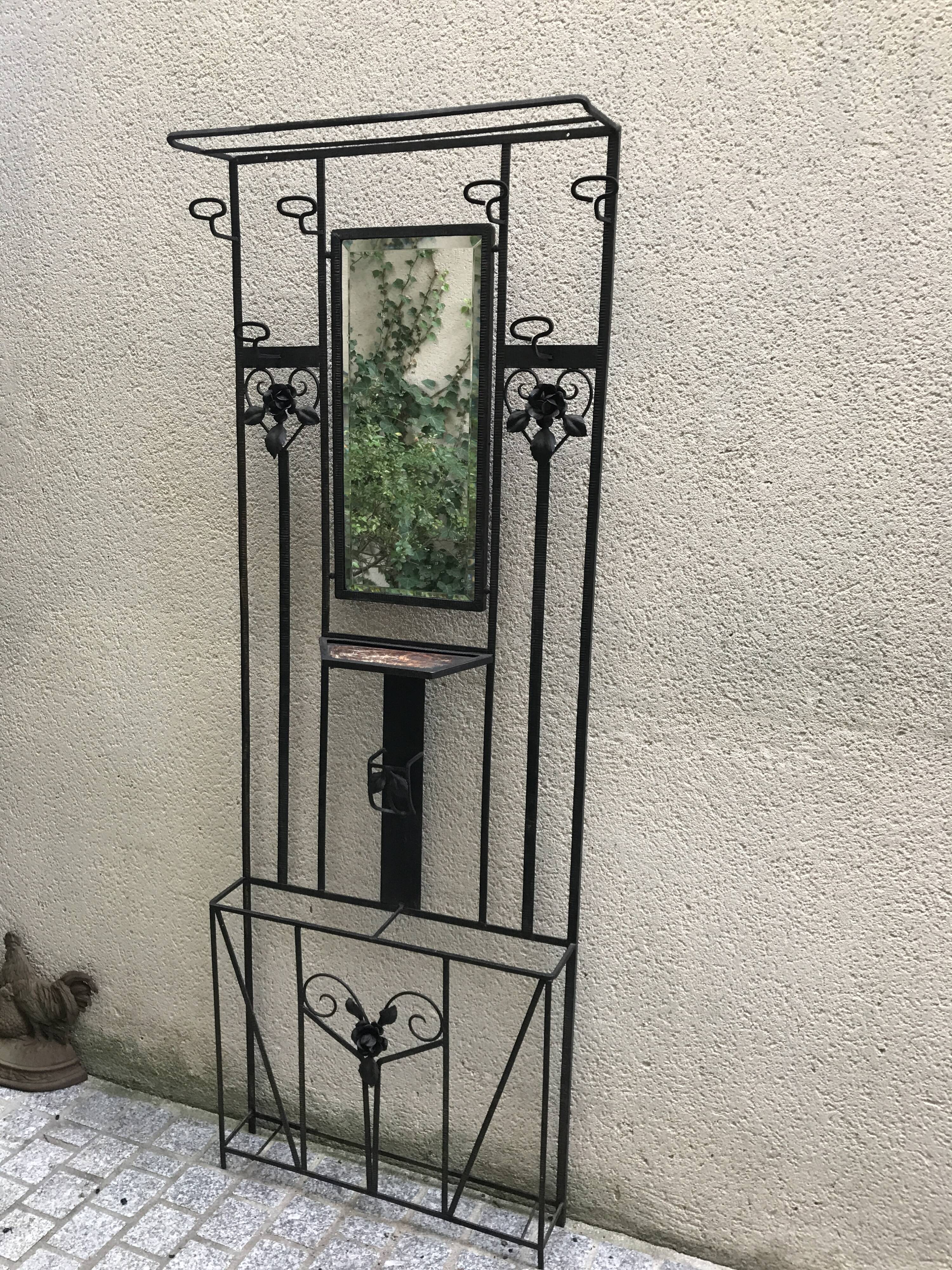 Wrought iron coat holder with 1930