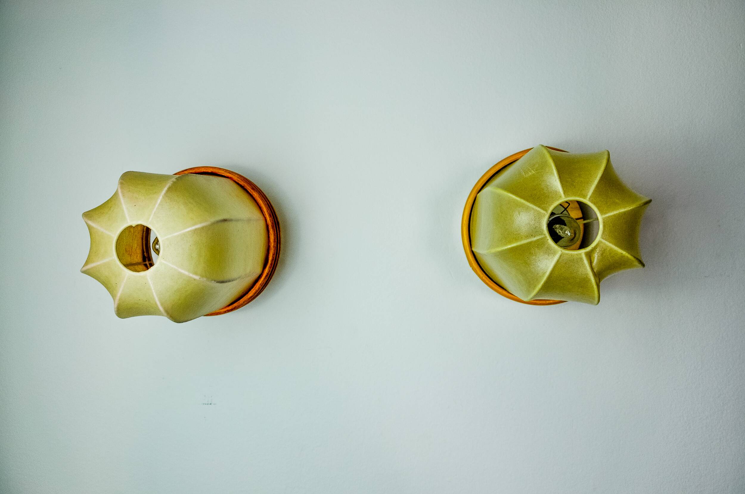 Pair of "cocoon" wall lights, resin and pine, Italy, 1970