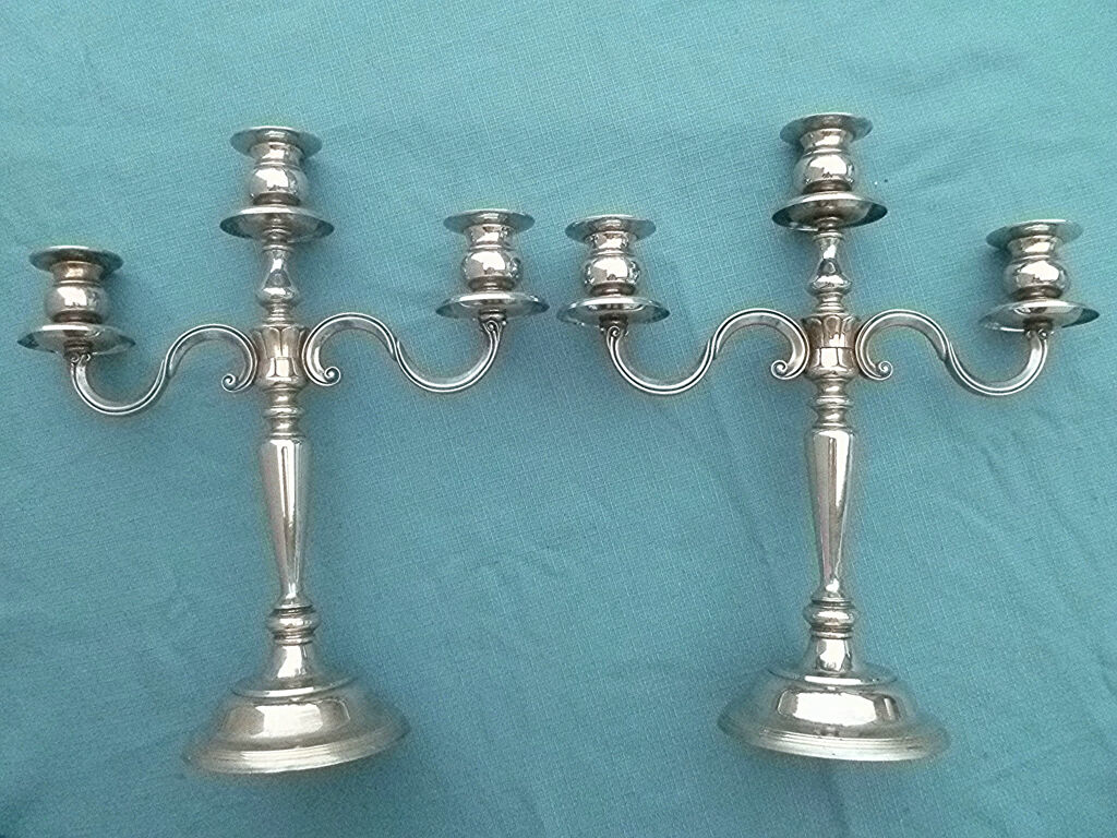 Pair of silver-colored metal candlesticks