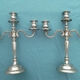 Pair of silver-colored metal candlesticks