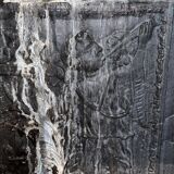 huge old fireplace plate has decoration of angels, crown and fleurs-de-lis