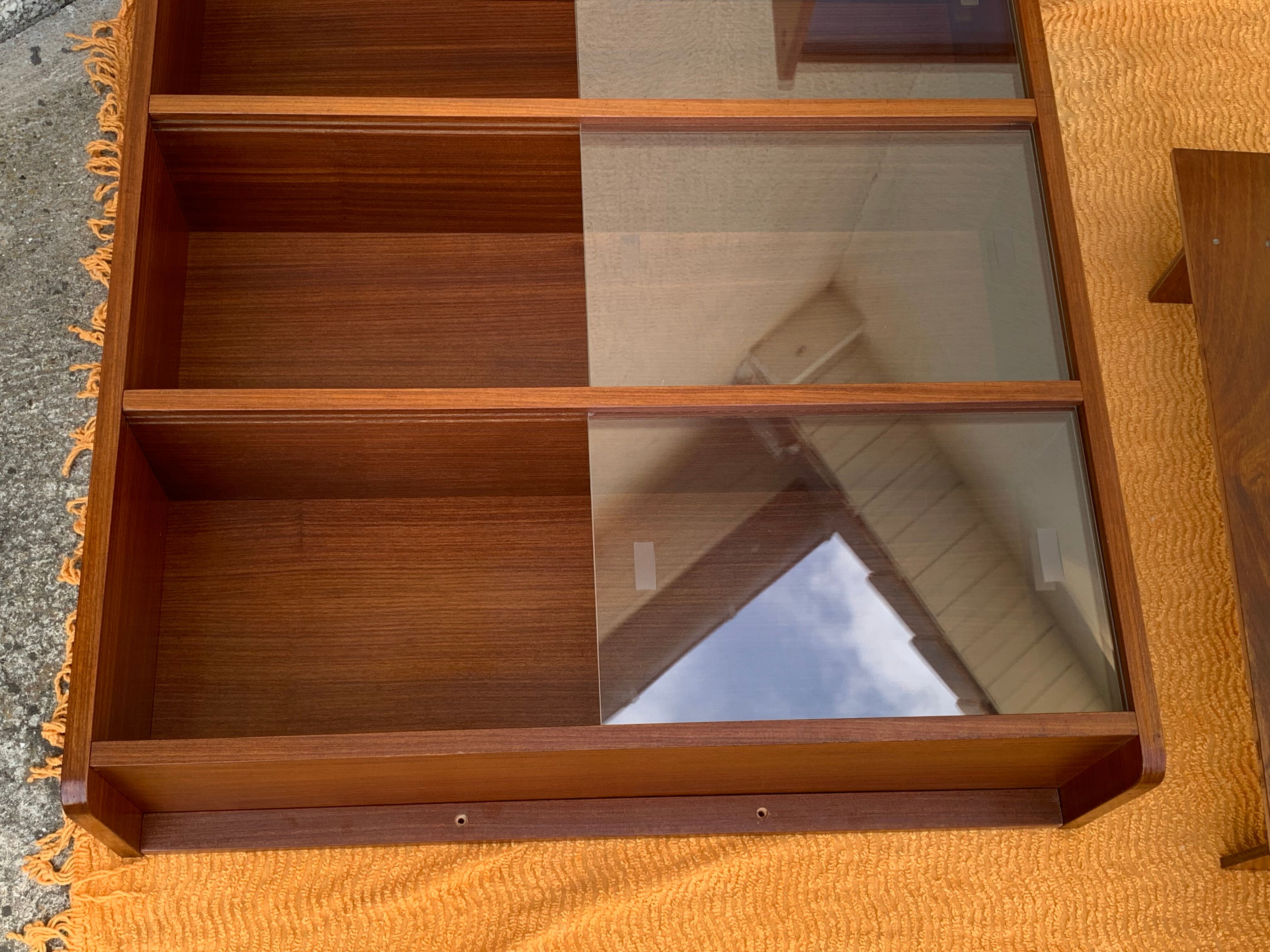 glass wall bookcase in vintage teak 1950
