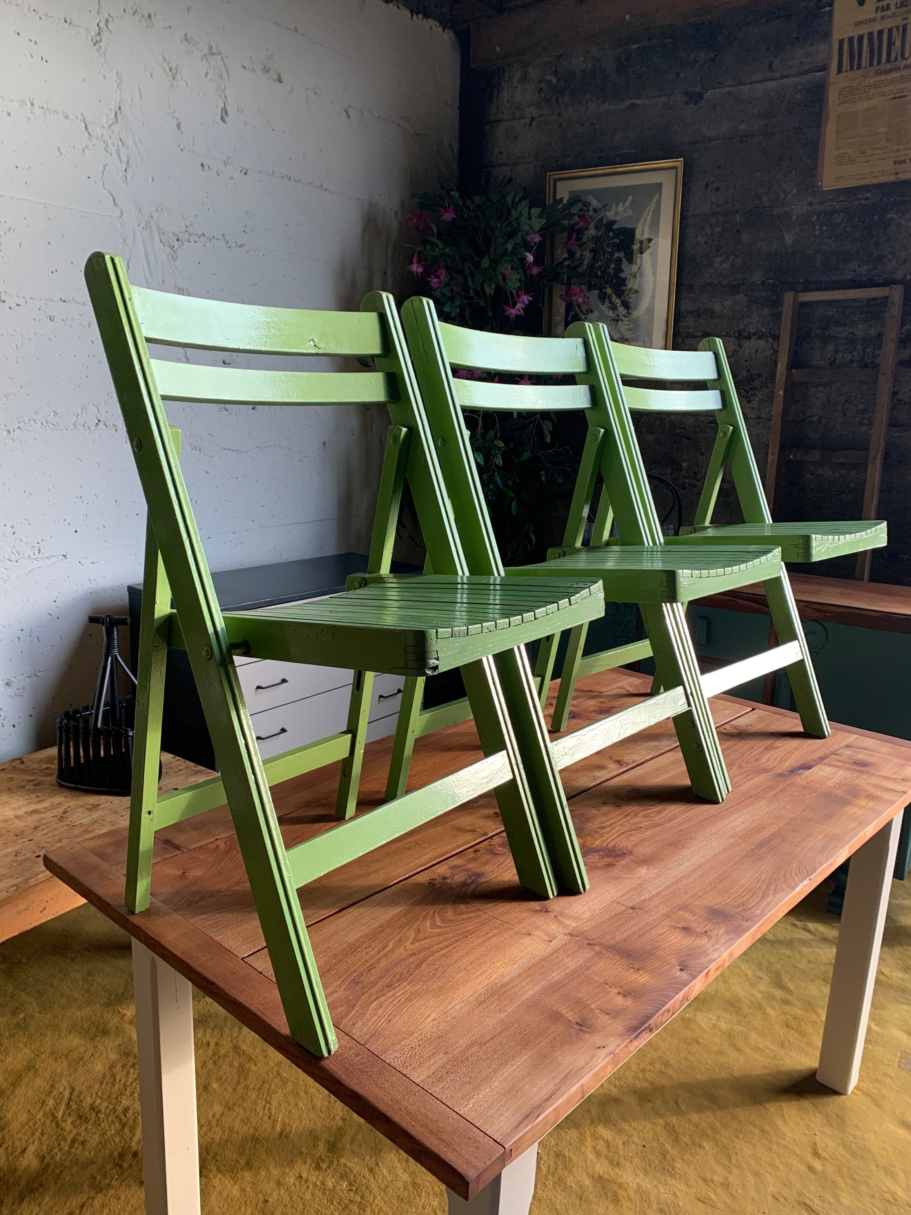 3 wooden folding chairs