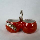 Porcelain salt shaker and orange pepper shaker decorated with a cicada
