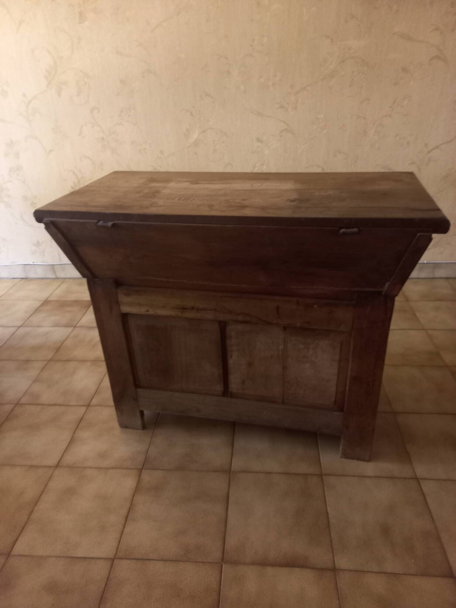 Old solid wood dough mixer carefully transformed into a bar cabinet.