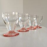 Lot of water in white and pink glass glasses