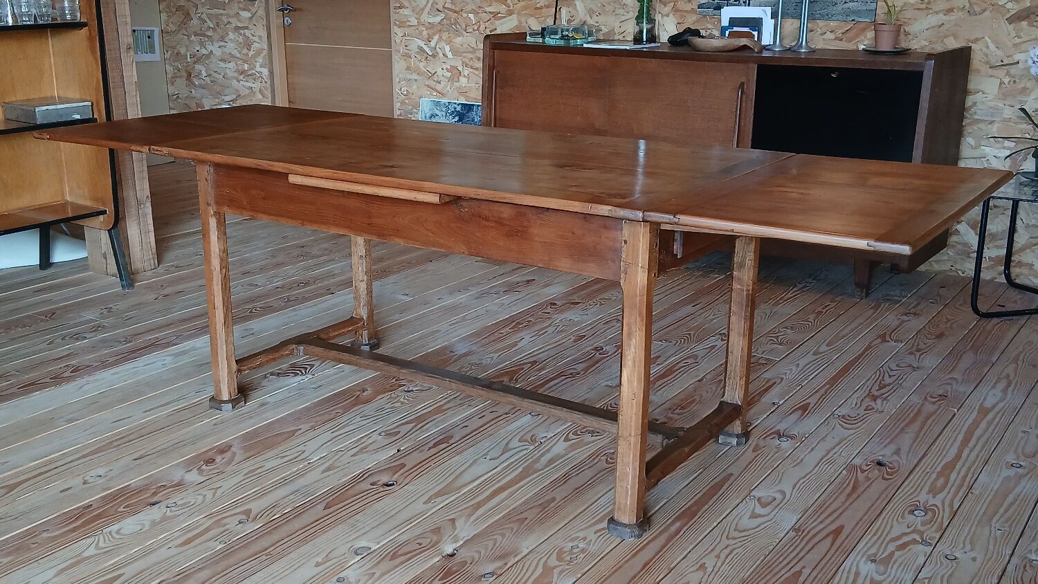 Elm farmhouse table with extensions for 6 to 10 people.
