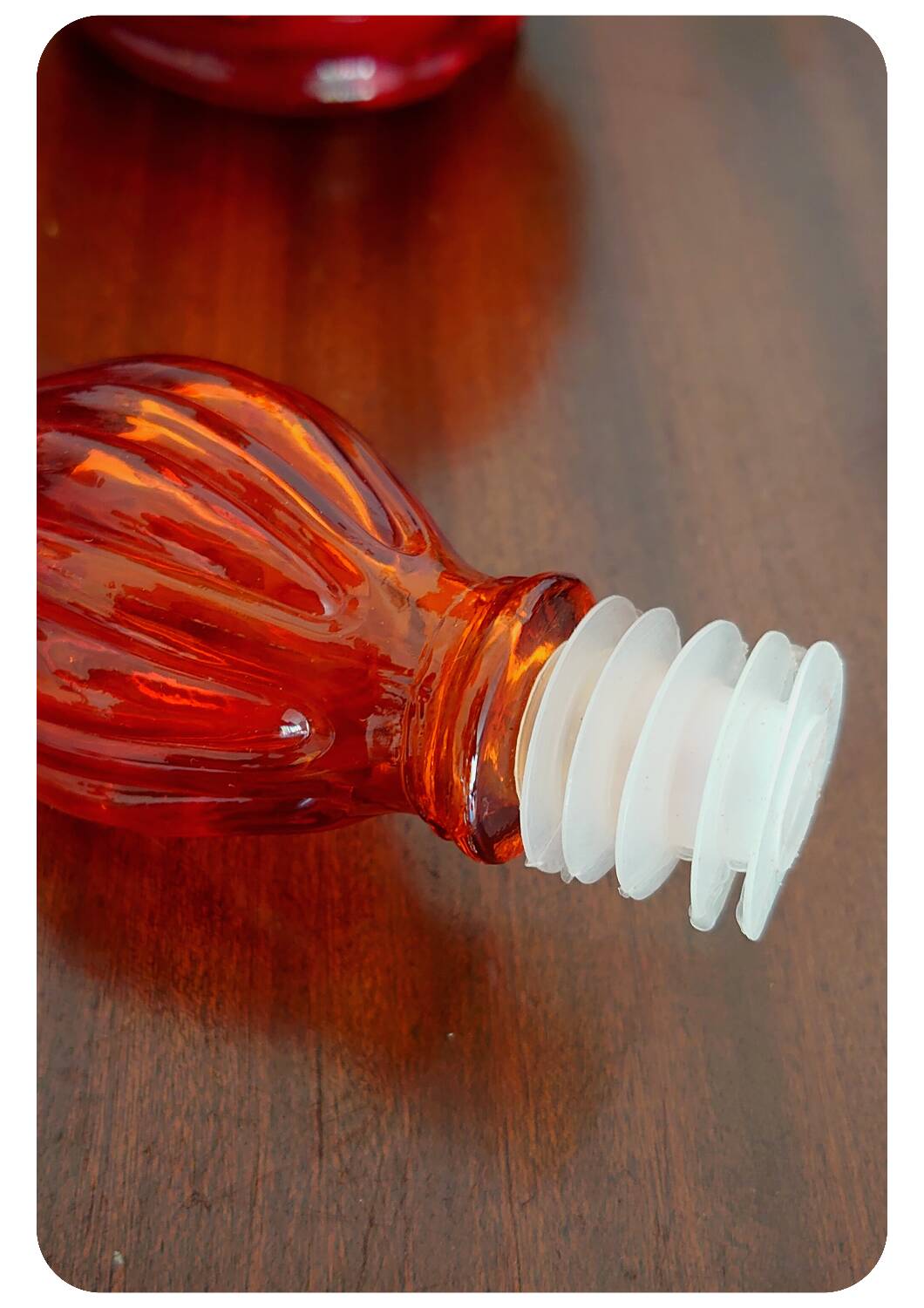 Amber orange corset empoli bottle with stopper