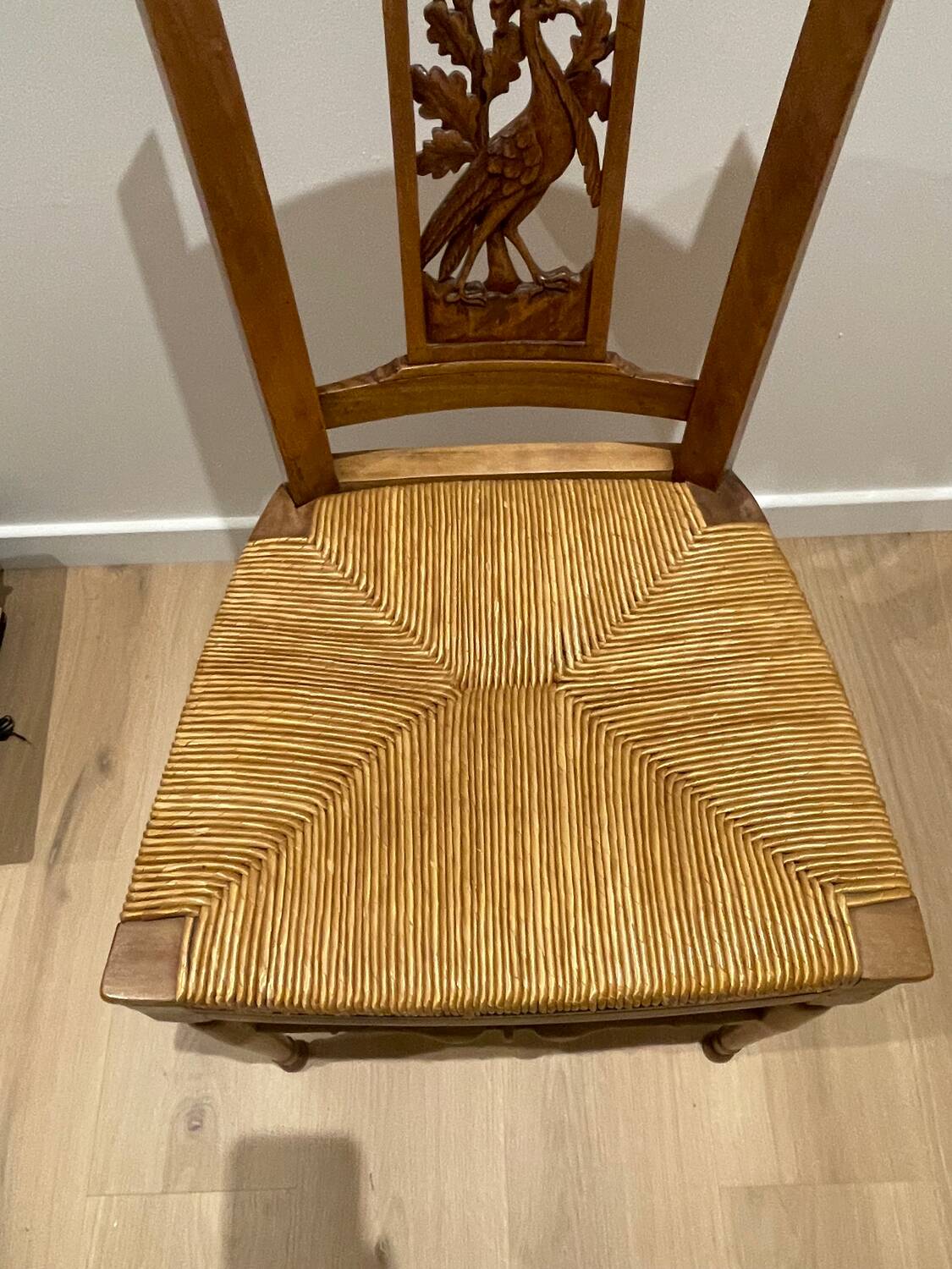 19th century straw chair with carved peacock back
