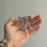 Set of 4 designer egg cups in shiny silver metal