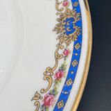 Limoges porcelain flat plates with blue border and small pink flowers