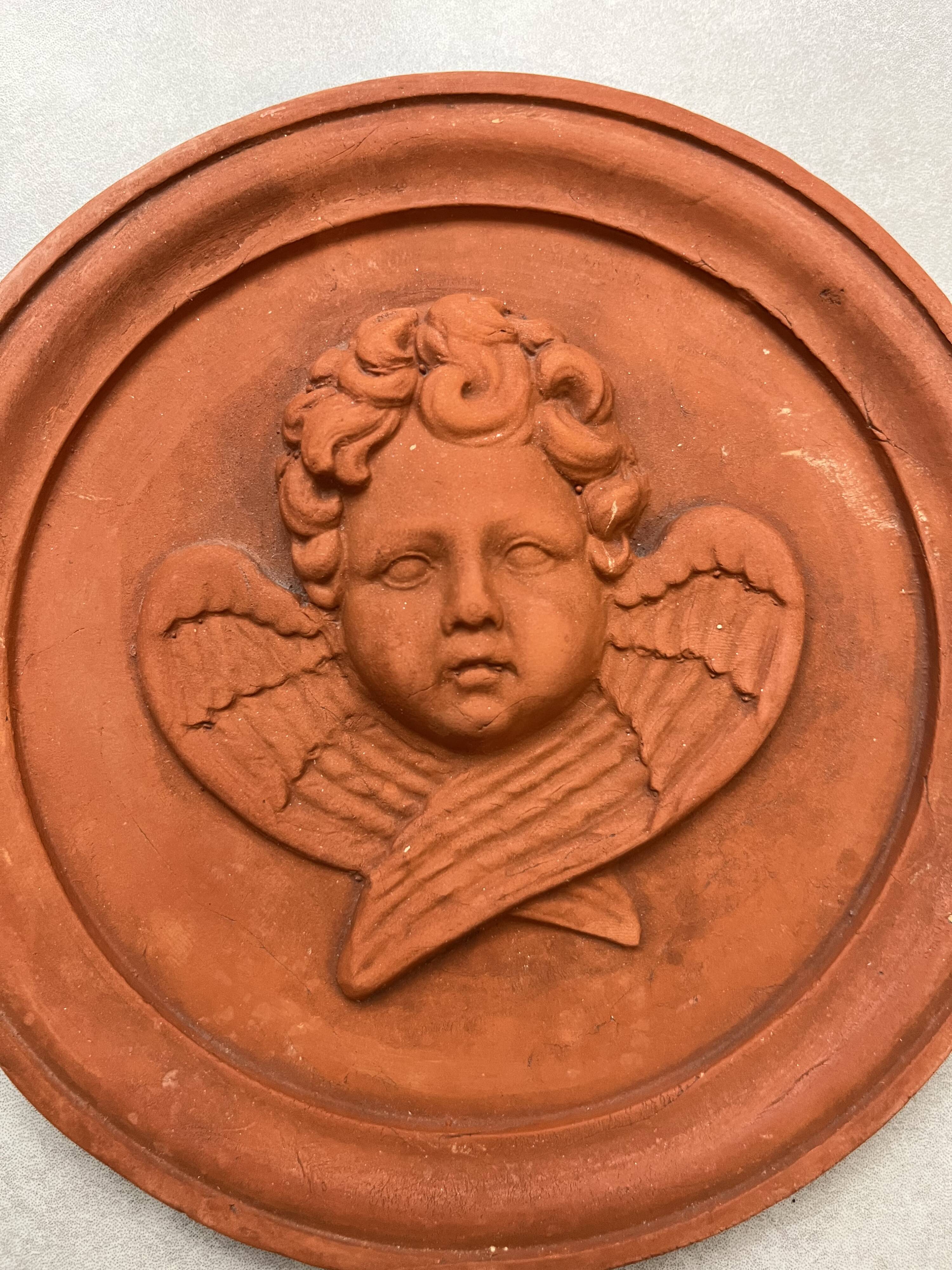 Hanging rondel "Cherub" terracotta