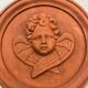Hanging rondel "Cherub" terracotta