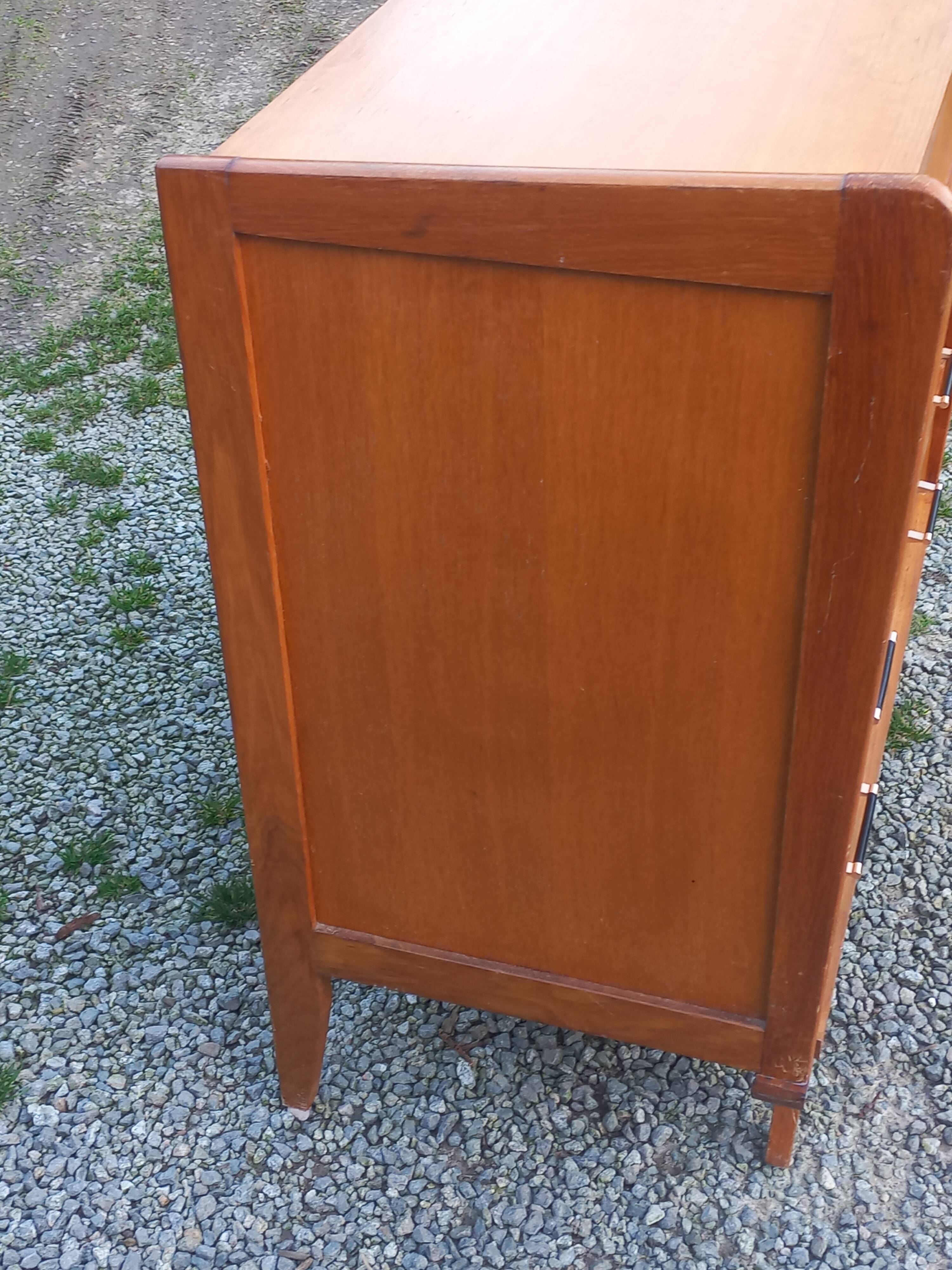 Vintage oak commode with tapered legs and wings from the 1950s.